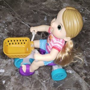 Baby Alive doll with bicycle